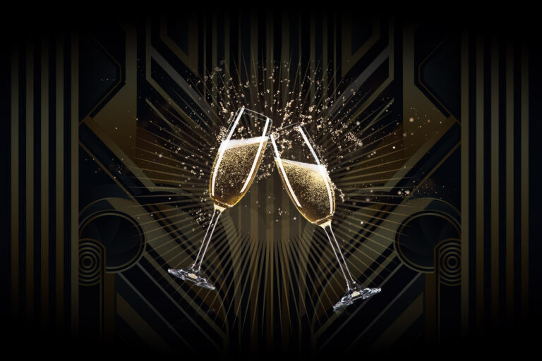a pair of champagne glasses with splashing liquid