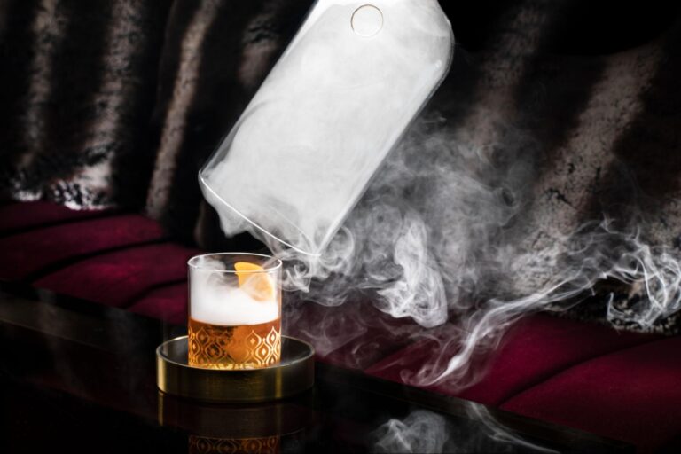 a glass with smoke coming out of it